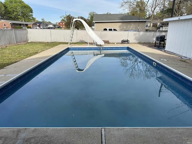 2702 Eastern Ave, Bedford, IN 47421 - view of swimming pool with a water slide, a fenced backyard, and a grill