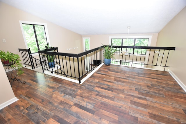 9428 S Lake Ridge Dr, Bloomington, IN 47401 - staircase with wood finished floors, baseboards, and lofted ceiling