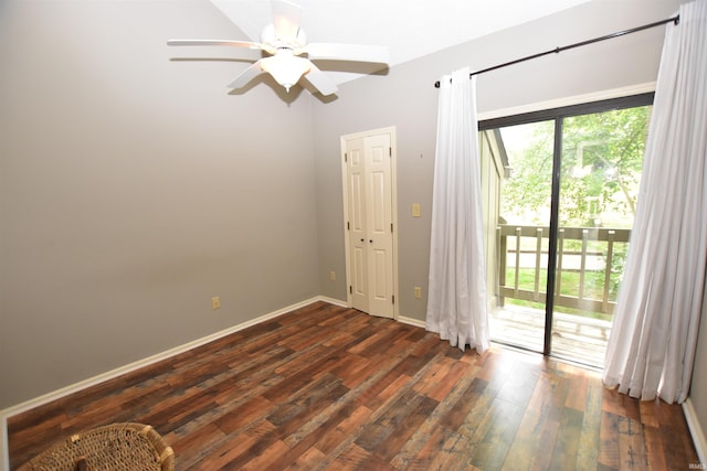 9428 S Lake Ridge Dr, Bloomington, IN 47401 - unfurnished room with dark wood-style flooring, ceiling fan, and baseboards