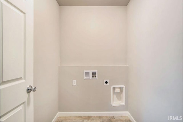 405 Somerfield Dr, Lakeville, IN 46536 - laundry area with electric dryer hookup, hookup for a washing machine, and baseboards