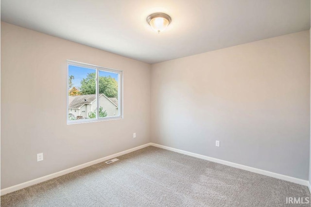 405 Somerfield Dr, Lakeville, IN 46536 - carpeted empty room featuring baseboards