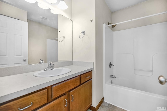 18310 Gyr Ct, New Paris, IN 46553 - bathroom featuring vanity, shower / washtub combination, tile patterned flooring, and baseboards