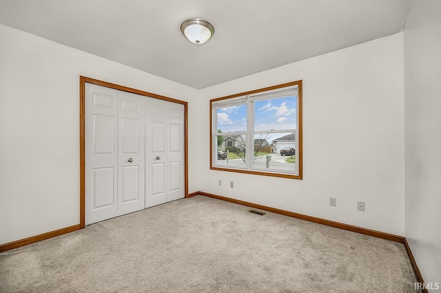 18310 Gyr Ct, New Paris, IN 46553 - unfurnished bedroom featuring carpet, baseboards, and a closet