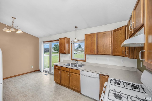 18310 Gyr Ct, New Paris, IN 46553 - kitchen featuring white appliances, a sink, brown cabinetry, and lofted ceiling