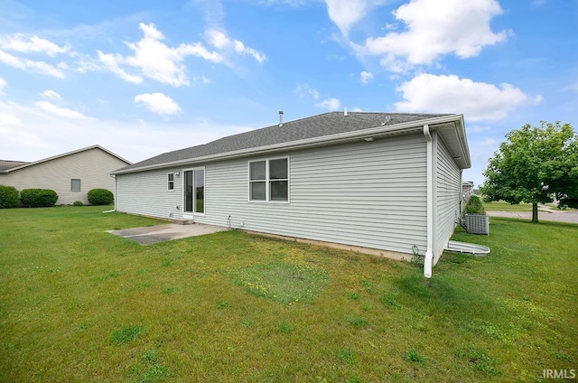 18310 Gyr Ct, New Paris, IN 46553 - back of property with a lawn, a patio, and central AC unit