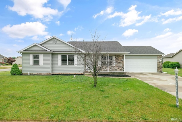 18310 Gyr Ct, New Paris, IN 46553 - single story home with concrete driveway, a garage, a front lawn, and stone siding