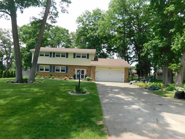 53341 Crestview Dr, South Bend, IN 46635 - view of front of home with a garage, driveway, a front yard, and brick siding