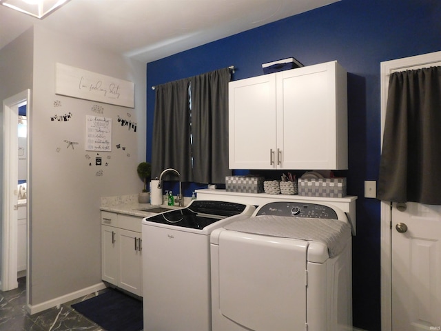 53341 Crestview Dr, South Bend, IN 46635 - laundry area with independent washer and dryer, dark marble finish flooring, and cabinet space