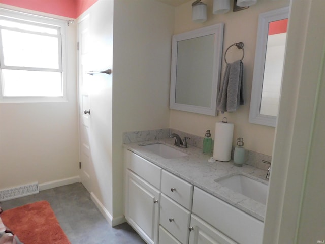 53341 Crestview Dr, South Bend, IN 46635 - full bathroom featuring double vanity and baseboards