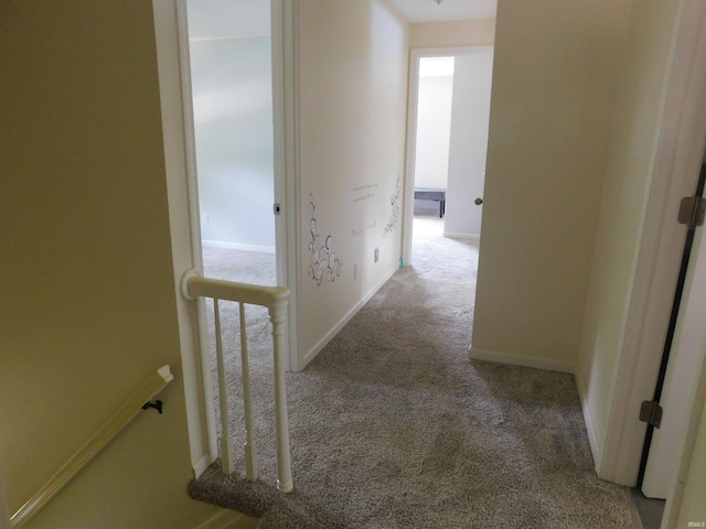 53341 Crestview Dr, South Bend, IN 46635 - hallway featuring carpet floors, baseboards, and an upstairs landing