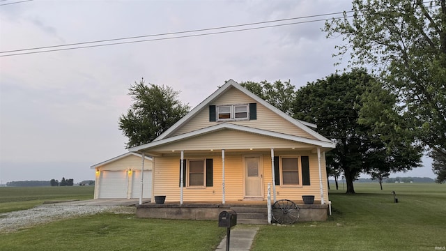 8253 S 900 W Unit 35, Lafontaine, IN 46940 - bungalow-style home with driveway, a porch, a front yard, and an attached garage