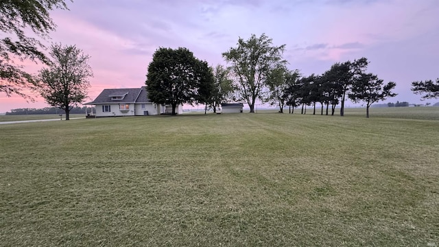 8253 S 900 W Unit 35, Lafontaine, IN 46940 - yard at dusk featuring a lawn
