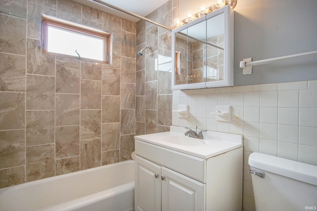2659 Castine Walk, Mishawaka, IN 46544 - bathroom featuring toilet, shower / bathtub combination, vanity, tile walls, and decorative backsplash