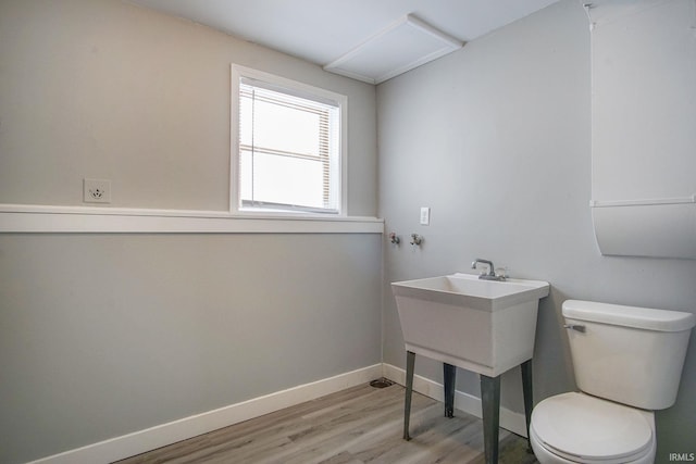 2659 Castine Walk, Mishawaka, IN 46544 - half bathroom featuring wood finished floors, toilet, and baseboards