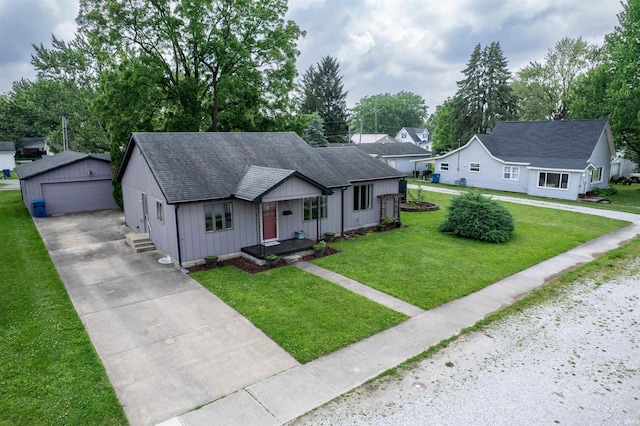 614 E S B St, Gas City, IN 46933 - view of front of home featuring a garage, an outbuilding, roof with shingles, a front lawn, and board and batten siding