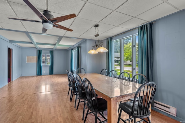 614 E S B St, Gas City, IN 46933 - dining room with baseboard heating, plenty of natural light, light wood-style floors, a ceiling fan, and a decorative wall