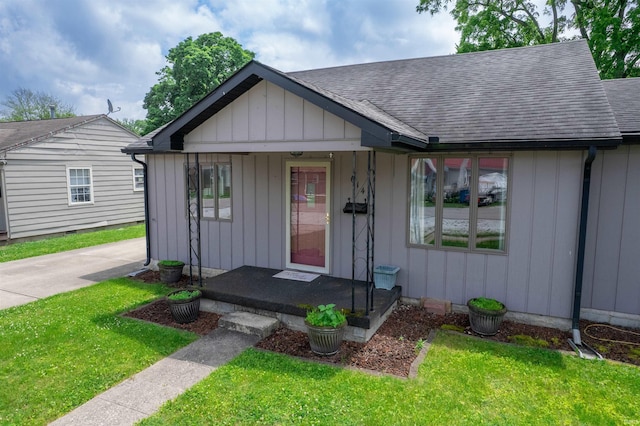 614 E S B St, Gas City, IN 46933 - view of front of property with roof with shingles, a front yard, and board and batten siding