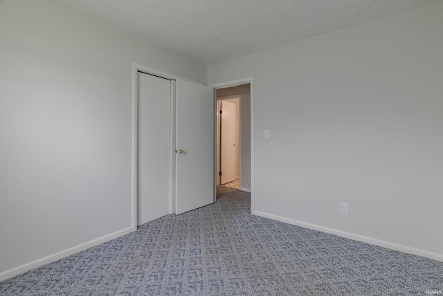 1113 E 500 S, Wabash, IN 46992 - unfurnished bedroom featuring carpet flooring, baseboards, and a textured ceiling