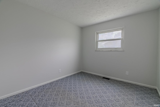 1113 E 500 S, Wabash, IN 46992 - empty room featuring carpet, a textured ceiling, and baseboards