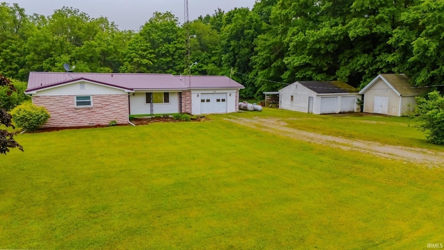 1113 E 500 S, Wabash, IN 46992 - single story home featuring dirt driveway, a front yard, metal roof, stone siding, and an attached garage