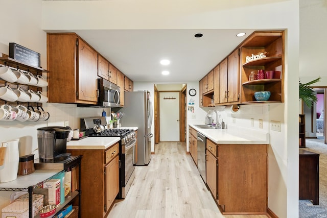 5816 Bayside Dr, Fort Wayne, IN 46815 - kitchen with stainless steel appliances, open shelves, a sink, light countertops, and light wood-style floors