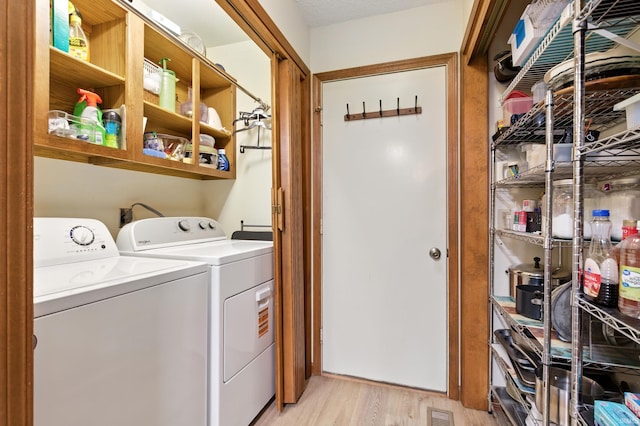 5816 Bayside Dr, Fort Wayne, IN 46815 - laundry area with independent washer and dryer and light wood-style flooring