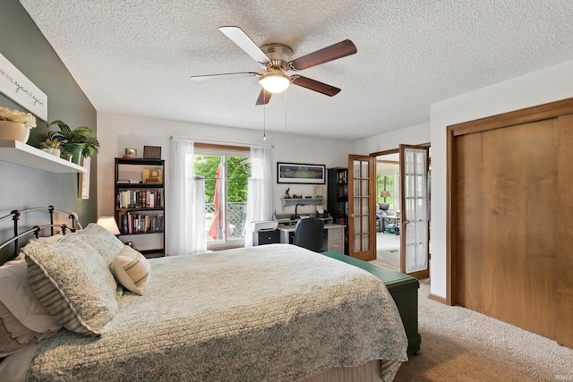 5816 Bayside Dr, Fort Wayne, IN 46815 - carpeted bedroom with french doors, a textured ceiling, an office area, ceiling fan, and a closet