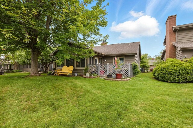 5816 Bayside Dr, Fort Wayne, IN 46815 - back of property featuring a yard and a chimney