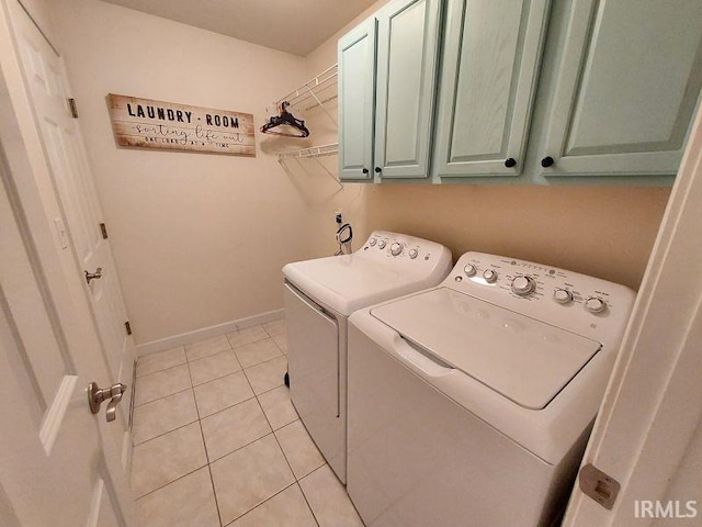 1749 W 1st St, Jasper, IN 47546 - laundry room with cabinet space, washer and clothes dryer, light tile patterned floors, and baseboards