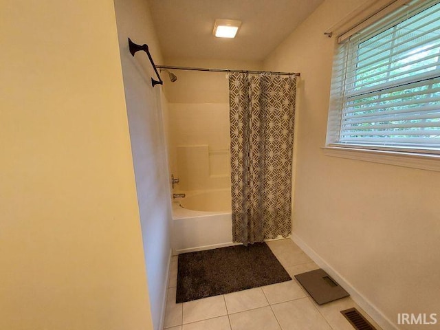 1749 W 1st St, Jasper, IN 47546 - bathroom with tile patterned flooring, shower / bath combo, and baseboards