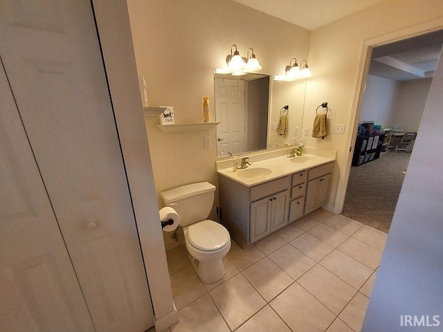 1749 W 1st St, Jasper, IN 47546 - bathroom featuring tile patterned flooring, double vanity, toilet, and a closet