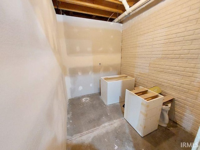 1749 W 1st St, Jasper, IN 47546 - laundry area with brick wall