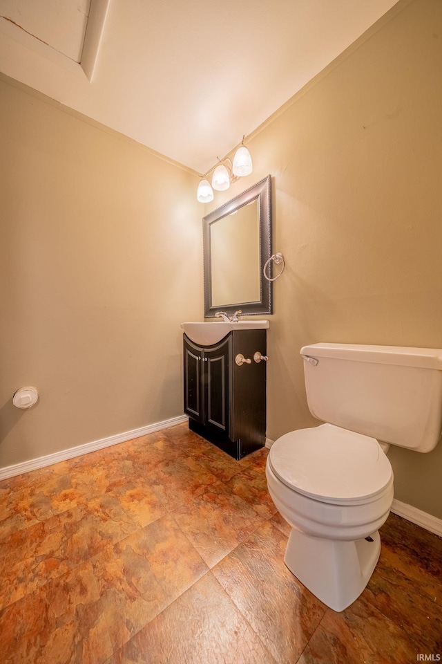 3005 Darwin Ln, Kokomo, IN 46902 - bathroom featuring toilet, vanity, baseboards, and stone finish flooring