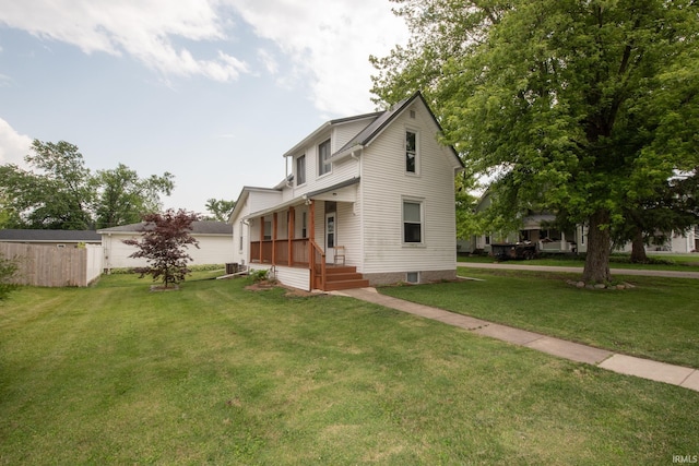 333 Wyandotte Rd, Mulberry, IN 46058 - traditional home featuring a porch, a front yard, and cooling unit
