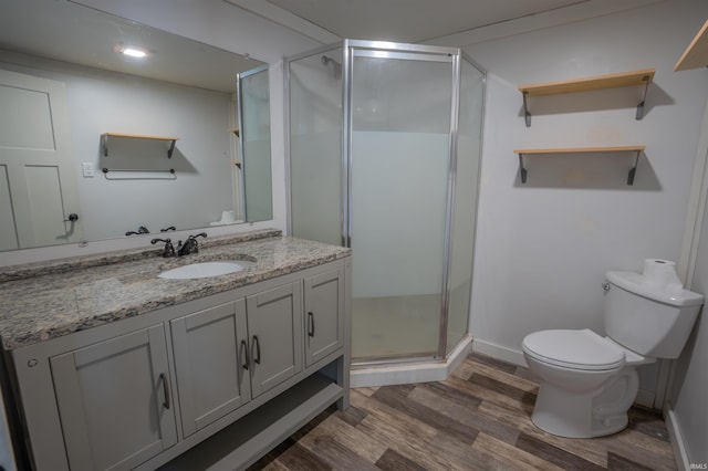 208 N Heaton St, Knox, IN 46534 - full bath with wood finished floors, vanity, a stall shower, toilet, and baseboards