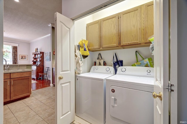 723 E Moss Creek Dr, Bloomington, IN 47401 - washroom with cabinet space, separate washer and dryer, crown molding, light tile patterned flooring, and a textured ceiling