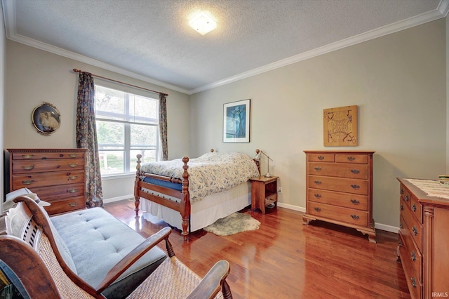 723 E Moss Creek Dr, Bloomington, IN 47401 - bedroom featuring wood finished floors, baseboards, crown molding, and a textured ceiling