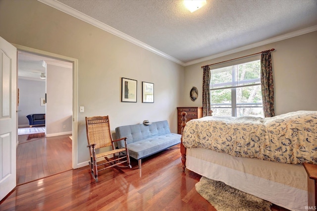 723 E Moss Creek Dr, Bloomington, IN 47401 - bedroom featuring wood finished floors, ornamental molding, a textured ceiling, and baseboards