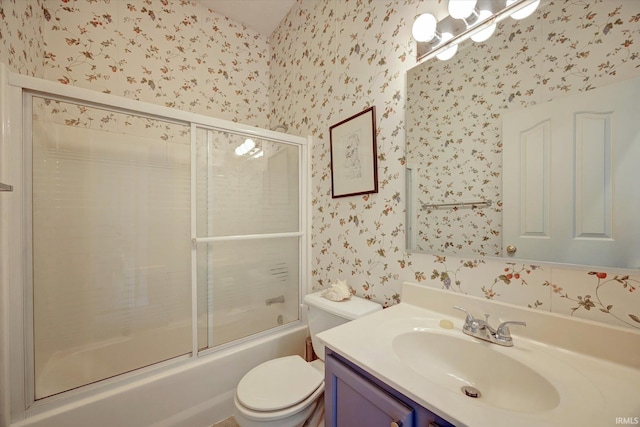 723 E Moss Creek Dr, Bloomington, IN 47401 - bathroom with wallpapered walls, vanity, toilet, and shower / bath combination with glass door