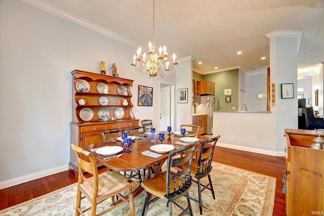 723 E Moss Creek Dr, Bloomington, IN 47401 - dining space featuring ornamental molding, baseboards, wood finished floors, recessed lighting, and a chandelier
