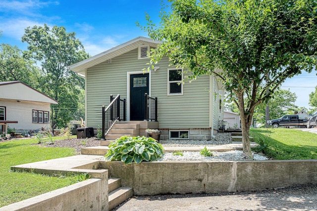 501 Spring Beach Rd, Rome City, IN 46784 - view of front facade featuring a front yard