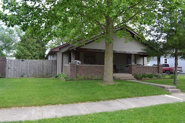 523 S Bluff St, Monticello, IN 47960 - bungalow-style home featuring a porch and brick siding