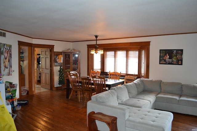 523 S Bluff St, Monticello, IN 47960 - living room with hardwood / wood-style floors, a chandelier, and crown molding