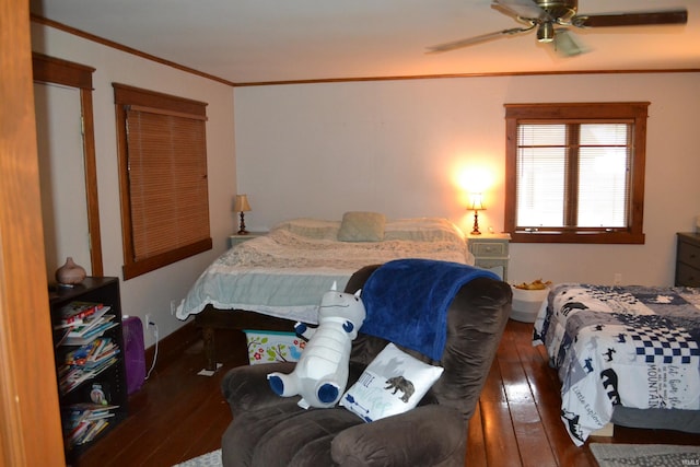 523 S Bluff St, Monticello, IN 47960 - bedroom with hardwood / wood-style flooring, ornamental molding, and a ceiling fan