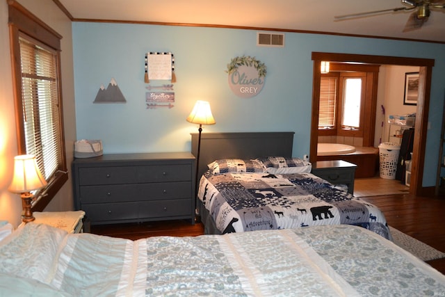 523 S Bluff St, Monticello, IN 47960 - bedroom with dark wood-style floors, crown molding, and multiple windows