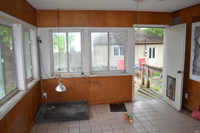 523 S Bluff St, Monticello, IN 47960 - sunroom / solarium featuring plenty of natural light, tile patterned flooring, and wood walls