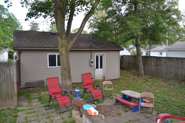 523 S Bluff St, Monticello, IN 47960 - fenced backyard featuring a patio and an outbuilding