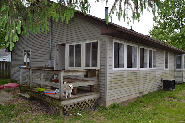 523 S Bluff St, Monticello, IN 47960 - back of property with a wooden deck and central AC