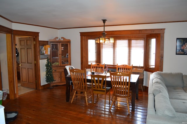 523 S Bluff St, Monticello, IN 47960 - dining room with wood-type flooring and ornamental molding