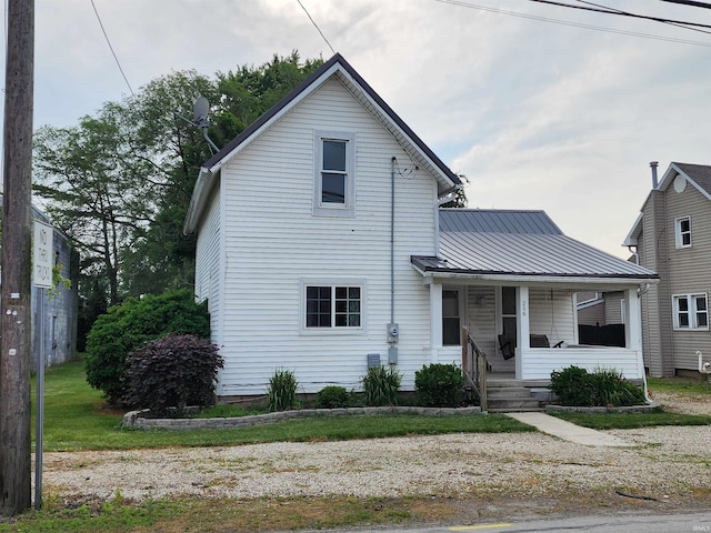 206 S Van Buren St, Monroe, IN 46772 - traditional-style house featuring a porch and metal roof